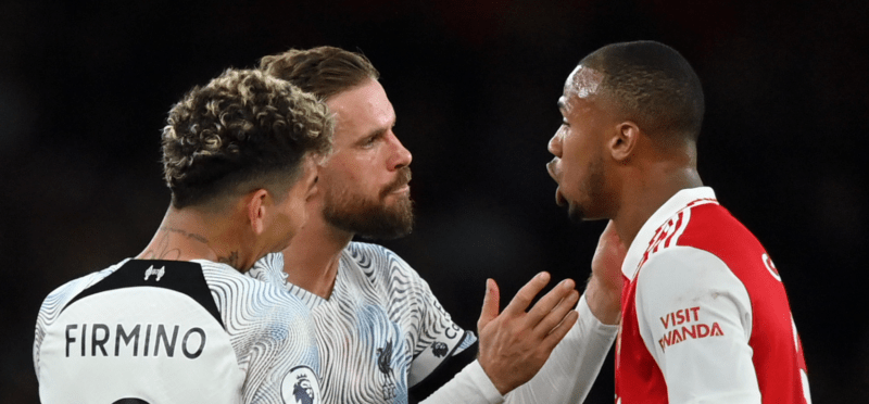 LONDON, ENGLAND - OCTOBER 09: Jordan Henderson of Liverpool speaks with Gabriel of Arsenal as Manager of Liverpool, Jurgen Klopp look on during the...