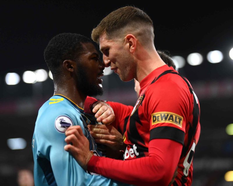 BOURNEMOUTH, ENGLAND - OCTOBER 19: Ainsley Maitland-Niles of Southampton confronts Chris Mepham of AFC Bournemouth during the Premier League match ...