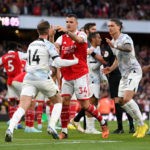 LONDON, ENGLAND - OCTOBER 09: Jordan Henderson of Liverpool clashes with Granit Xhaka of Arsenal after a penalty was given to Arsenal during the Premier League match between Arsenal FC and Liverpool FC at Emirates Stadium on October 09, 2022 in London, England. (Photo by Shaun Botterill/Getty Images)