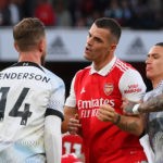 LONDON, ENGLAND - OCTOBER 09: Jordan Henderson of Liverpool clashes with Granit Xhaka of Arsenal after a penalty was given to Arsenal during the Premier League match between Arsenal FC and Liverpool FC at Emirates Stadium on October 09, 2022 in London, England. (Photo by Shaun Botterill/Getty Images)