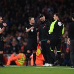 LONDON, ENGLAND - OCTOBER 09: Referee Michael Oliver speaks to Juergen Klopp, Manager of Liverpool during the Premier League match between Arsenal FC and Liverpool FC at Emirates Stadium on October 09, 2022 in London, England. (Photo by Shaun Botterill/Getty Images)