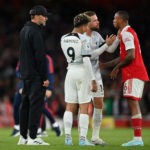 LONDON, ENGLAND - OCTOBER 09: Jordan Henderson of Liverpool speaks with Gabriel of Arsenal as Manager of Liverpool, Jurgen Klopp look on during the Premier League match between Arsenal FC and Liverpool FC at Emirates Stadium on October 09, 2022 in London, England. (Photo by Justin Setterfield/Getty Images)