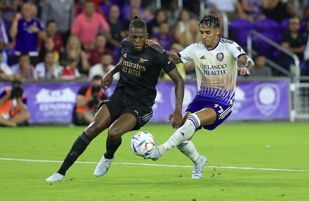 ORLANDO, FLORIDA: Nuno Tavares of Arsenal and Facundo Torres of Orlando City fight for the ball during a Florida Cup friendly at Exploria Stadium o...