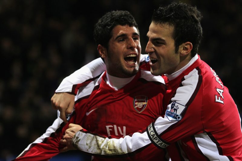 BOLTON, ENGLAND - JANUARY 17: Fran Merida of Arsenal celebrates scoring his team's second goal with team mate Cesc Fabregas (R) during the Barclays...