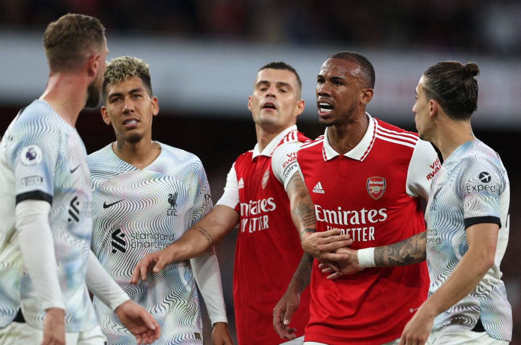 Arsenal's Brazilian defender Gabriel Magalhaes (2R) remonstrates with Liverpool's English midfielder Jordan Henderson during the English Premier League football match between Arsenal and Liverpool at the Emirates Stadium in London on October 9, 2022. (Photo by ADRIAN DENNIS/AFP via Getty Images)