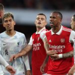 Arsenal's Brazilian defender Gabriel Magalhaes (2R) remonstrates with Liverpool's English midfielder Jordan Henderson during the English Premier League football match between Arsenal and Liverpool at the Emirates Stadium in London on October 9, 2022. (Photo by ADRIAN DENNIS/AFP via Getty Images)