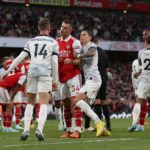 Liverpool's English midfielder Jordan Henderson (L) remonstrates with Arsenal's Swiss midfielder Granit Xhaka (centre L) after Arsenal were awarded a penalty during the English Premier League football match between Arsenal and Liverpool at the Emirates Stadium in London on October 9, 2022. (Photo by ADRIAN DENNIS/AFP via Getty Images)