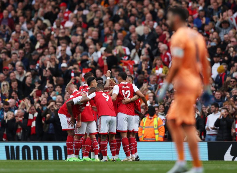 Arsenal players celebrate after Tottenham Hotspur's French goalkeeper Hugo Lloris failed to save a shot from Arsenal's Ghanaian midfielder Thomas P...