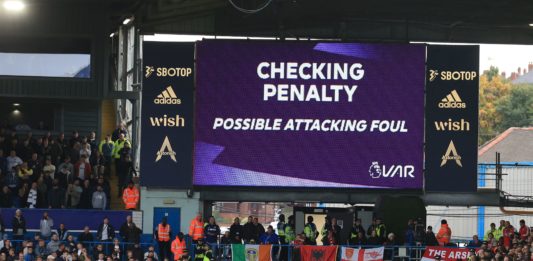 The big screen shows the reason VAR (Video Assistant Referee) are checking a possible Leeds penalty late in the game, overturned by English referee Chris Kavanagh during the English Premier League football match between Leeds United and Arsenal at Elland Road in Leeds, northern England on October 16, 2022. (Photo by LINDSEY PARNABY/AFP via Getty Images)