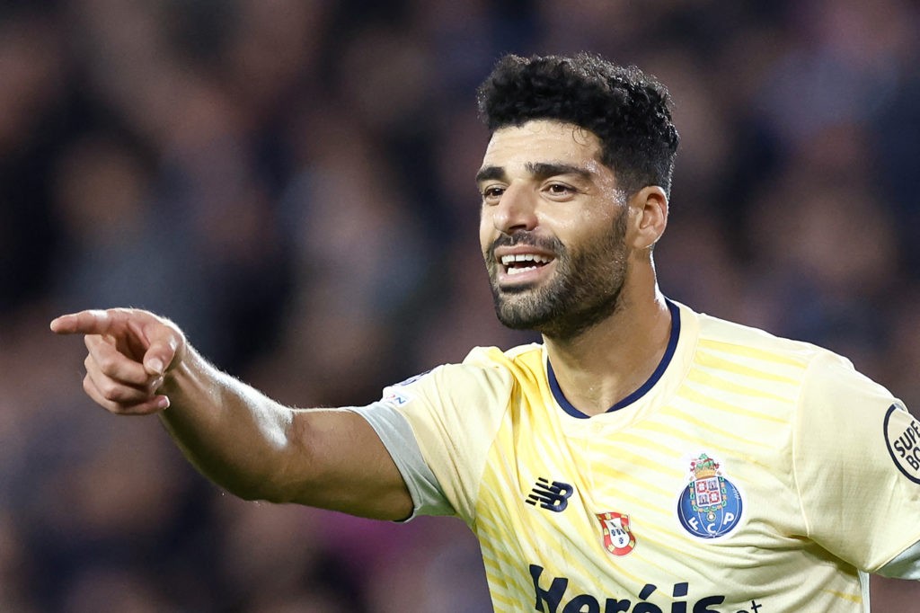 FC Porto's Iranian forward Mehdi Taremi celebrates scoring his team's fourth goal during the UEFA Champions League Group B second leg football match between Club Brugge KV (BEL) and FC Porto (POR) at the Jan Breydel Stadium in Bruges on October 26, 2022. (Photo by KENZO TRIBOUILLARD/AFP via Getty Images)