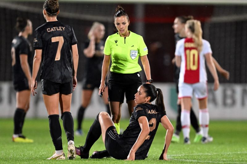 Arsenal confirm Brazilian's exit on free transfer 5 Arsenal's Australian defender Steph Catley (L) and Spanish referee Marta Huerta de Aza (C) look on as Arsenal's Brazilian midfielder Rafaelle Souza (bottom) sits on the pitch uring the UEFA Champions League women's second round football match between Ajax Amsterdam and Arsenal FC at De Toekomst sports complex in Amsterdam, on September 28, 2022. (Photo by GERRIT VAN KEULEN/ANP/AFP via Getty Images)