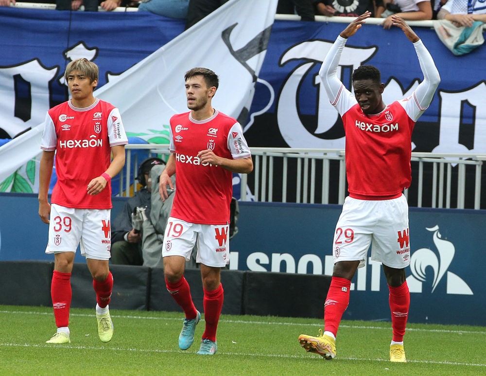 Reims striker Folarin Balogun (R) celebrates after scoring a goal during the French L1 football match between Troyes and Reims on October 2, 2022, ...