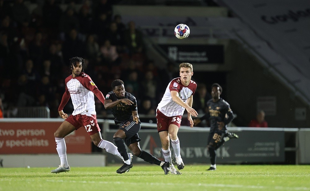 Arsenal reach EFL Trophy knockout rounds with comeback win 2 NORTHAMPTON, ENGLAND: Max Dyche and Akin Odimayo of Northampton Town look to the ball with Nathan Butler-Oyedeji of Arsenal U21 during the Papa John's Trophy match between Northampton Town and Arsenal U21 at Sixfields on October 18, 2022. (Photo by Pete Norton/Getty Images)