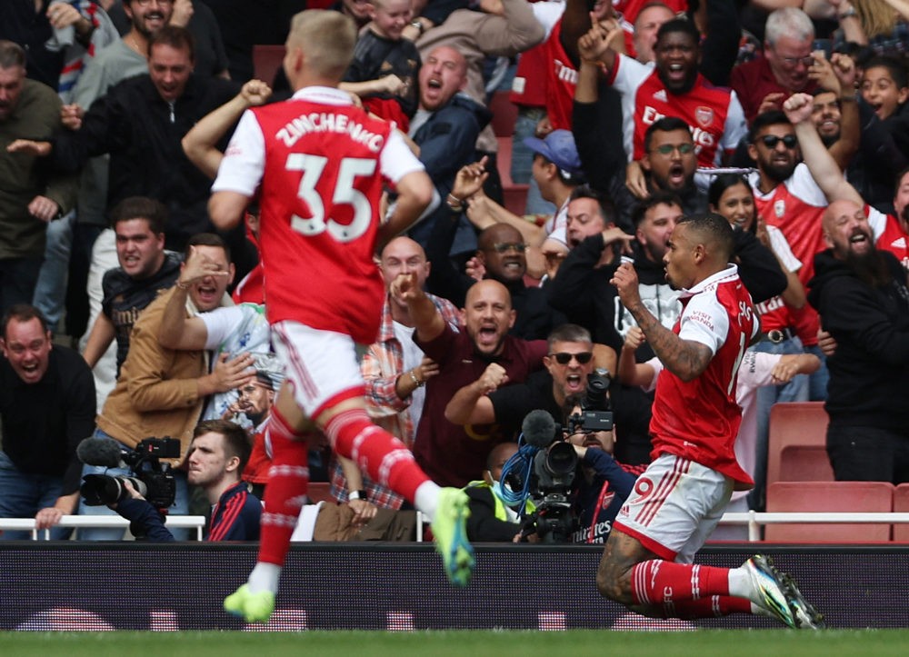 Arsenal's Brazilian striker Gabriel Jesus (R) celebrates scoring his team's second goal during the English Premier League football match between Arsenal and Tottenham Hotspur at the Emirates Stadium in London on October 1, 2022. (Photo by ADRIAN DENNIS/AFP via Getty Images)