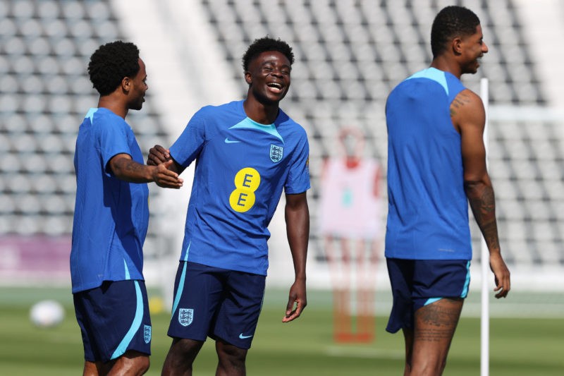 DOHA, QATAR - NOVEMBER 18: Bukayo Saka (c) alongside Raheem Stirling (l) and Marcus Rashford (r) during the England Training Session at Al Wakrah S...