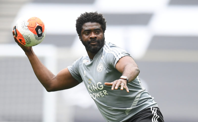 Leicester City's first team coach Kolo Toure warms up the players ahead of the English Premier League football match between Tottenham Hotspur and ...
