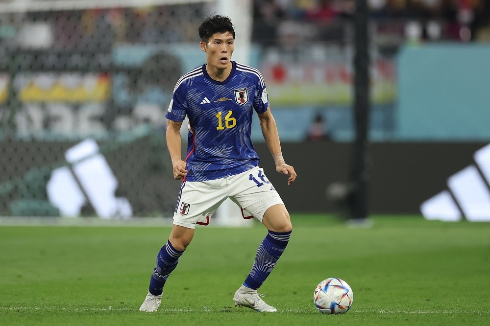 DOHA, QATAR: Takehiro Tomiyasu of Japan controls the ball during the FIFA World Cup Qatar 2022 Group E match between Germany and Japan at Khalifa I...