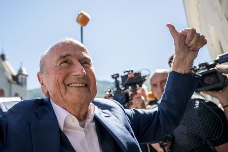 Sepp Blatter: Qatar World Cup a 'mistake' 2 TOPSHOT - Former FIFA president Sepp Blatter gives a thumb up as he leaves Switzerland's Federal Criminal Court after the verdict of his trial over a suspected fraudulent payment, in the southern Switzerland city of Bellinzona, on July 8, 2022. - Sepp Blatter and Michel Platini, once the chiefs of world and European football, were acquitted by a Swiss court on July 8, 2022 following a trial over a suspected fraudulent payment. (Photo by Fabrice COFFRINI / AFP) (Photo by FABRICE COFFRINI/AFP via Getty Images)