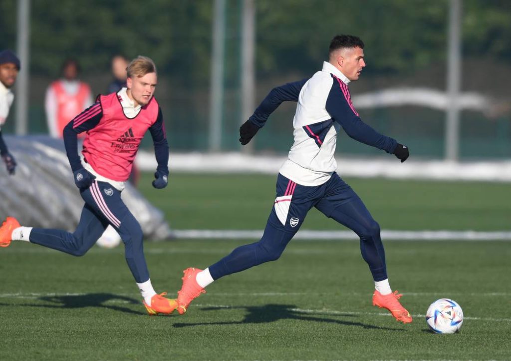 Matt Smith chasing down Granit Xhaka in training with Arsenal (Photo via Arsenal.com)