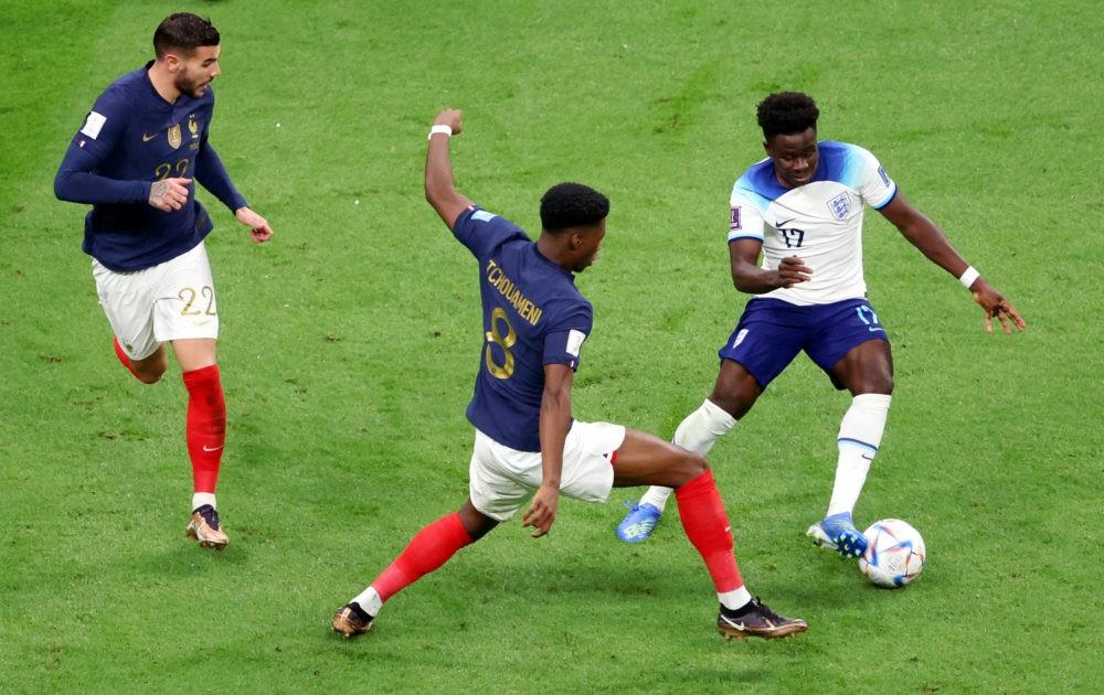 AL KHOR, QATAR: Bukayo Saka of England is fouled by Aurelien Tchouameni of France in the box resulting in a penalty during the FIFA World Cup Qatar...