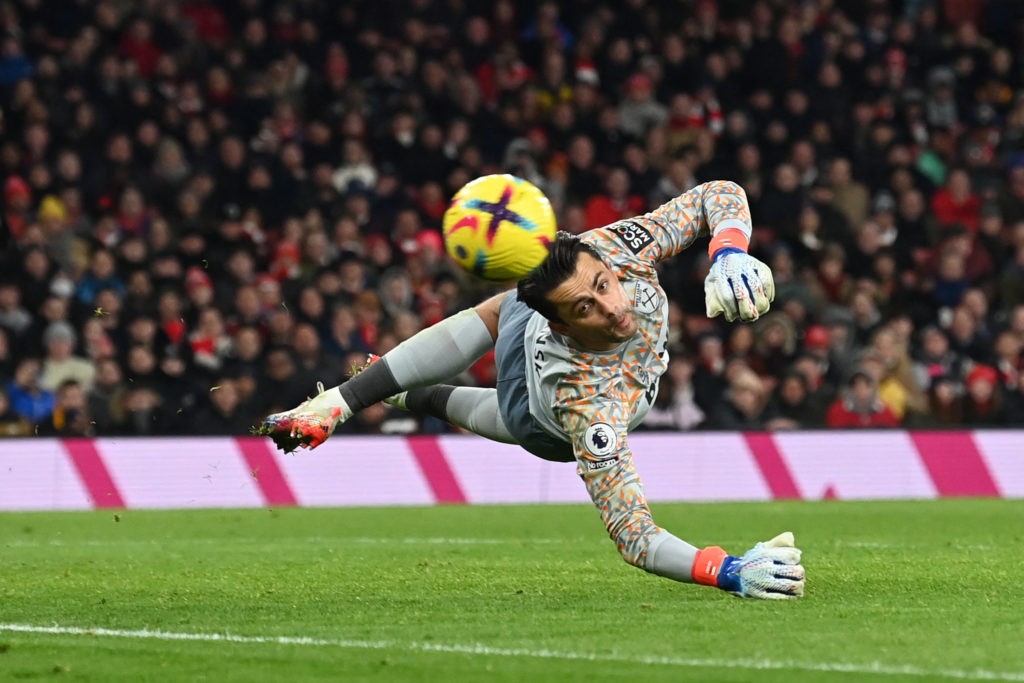 West Ham United's Polish goalkeeper Lukasz Fabianski eyes the ball shot by Arsenal's Norwegian midfielder Martin Odegaard during the English Premier League football match between Arsenal and West Ham United at the Emirates Stadium in London on December 26, 2022. (Photo by GLYN KIRK/AFP via Getty Images)