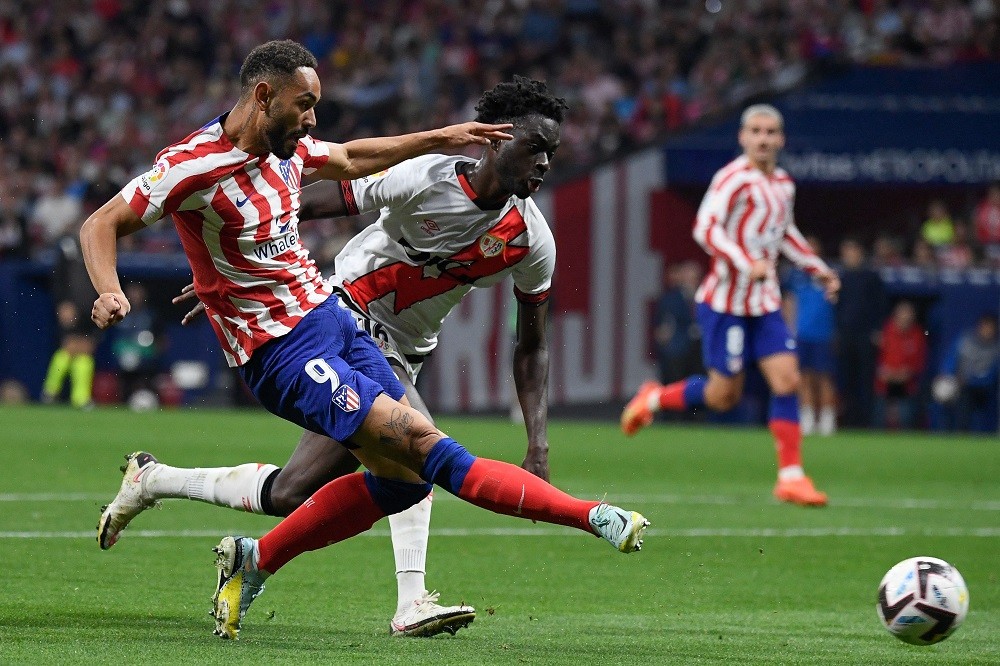 Atletico Madrid's Brazilian forward Matheus Cunha (L) kicks the ball during the Spanish league football match between Club Atletico de Madrid and R...