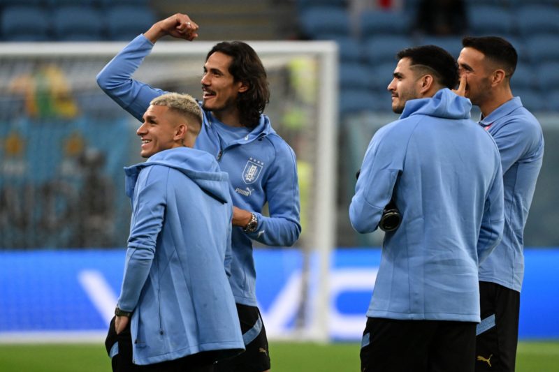 Uruguay's midfielder #14 Lucas Torreira (L), Uruguay's forward #21 Edinson Cavani (2L), Uruguay's forward #18 Maximiliano Gomez and Uruguay's midfielder #05 Matias Vecino walk around the stadium ahead of the Qatar 2022 World Cup Group H football match between Ghana and Uruguay at the Al-Janoub Stadium in Al-Wakrah, south of Doha on December 2, 2022.  (Photo by PABLO PORCIUNCULA/AFP via Getty Images)