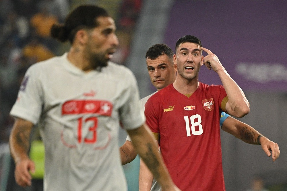 Journalist clarifies Arsenal interest in Dusan Vlahovic 2 Serbian forward Dusan Vlahovic gestures next to Switzerland's Granit Xhaka during the Qatar 2022 World Cup Group G football match between Serbia and Switzerland at Stadium 974 in Doha on December 2, 2022. (Photo by ANDREJ ISAKOVIC/AFP via Getty Images)