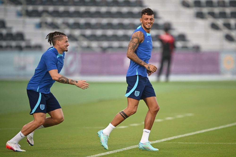 England's midfielder Kalvin Phillips (L) and England's defender Ben White take part in a training session at the Al Wakrah SC Stadium in Al Wakrah,...
