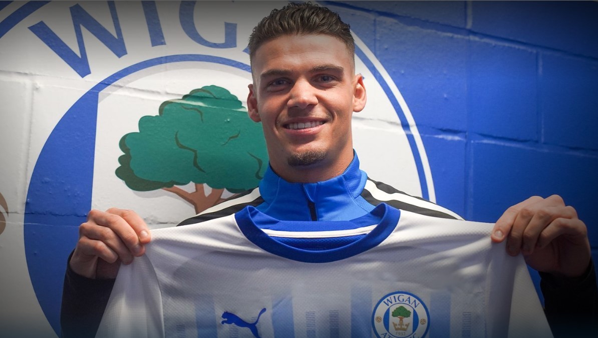 Omar Rekik after signing for Wigan (Photo via WiganAthletic.com)
