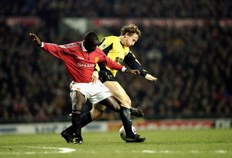 24 Jan 2000: Andy Cole of Manchester United battles with Ray Parlour of Arsenal during the FA Carling Premier League match played at Old Trafford in Manchester, England. The game finished in a 1-1 draw. Credit: Alex Livesey /Allsport