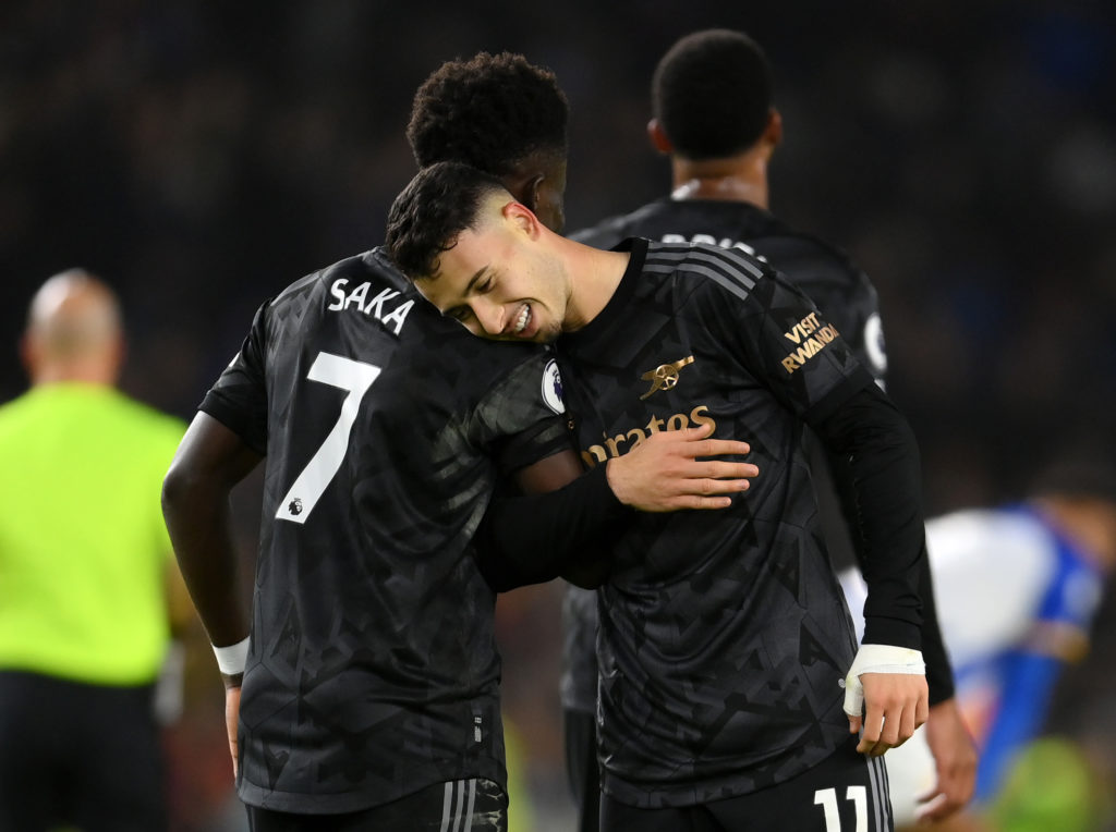 BRIGHTON, ENGLAND - DECEMBER 31: Gabriel Martinelli of Arsenal celebrates with teammate Bukayo Saka after scoring the team's fourth goal during the Premier League match between Brighton & Hove Albion and Arsenal FC at American Express Community Stadium on December 31, 2022 in Brighton, England. (Photo by Mike Hewitt/Getty Images)