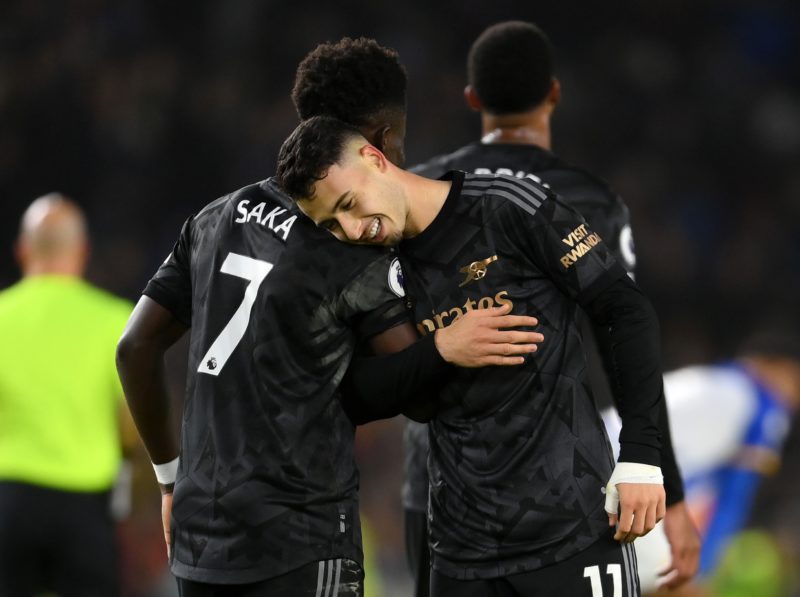 BRIGHTON, ENGLAND - DECEMBER 31: Gabriel Martinelli of Arsenal celebrates with teammate Bukayo Saka after scoring the team's fourth goal during the Premier League match between Brighton & Hove Albion and Arsenal FC at American Express Community Stadium on December 31, 2022 in Brighton, England. (Photo by Mike Hewitt/Getty Images)