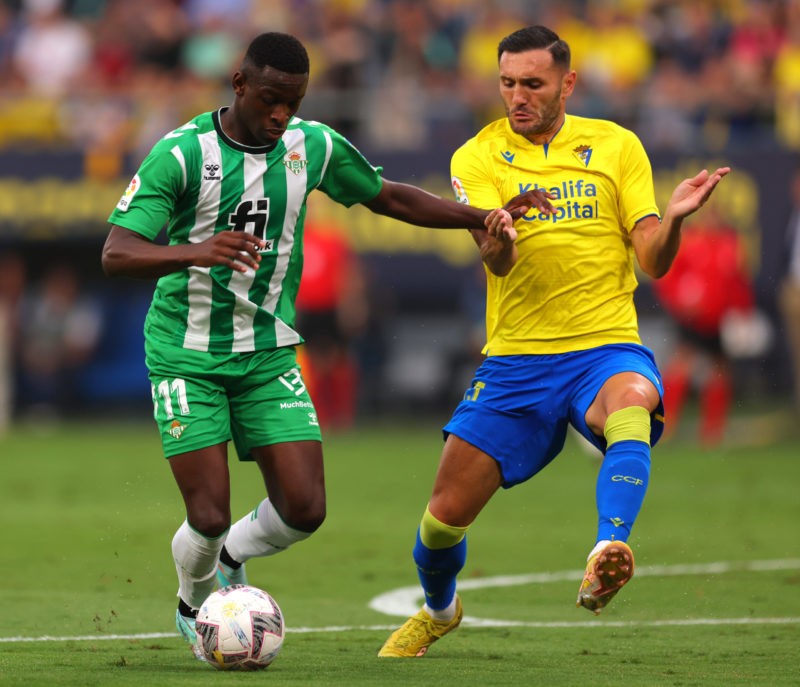 CADIZ, SPAIN - OCTOBER 19: Lucas Perez of Cadiz CF is challenged by Luiz Henrique of Real Betis during the LaLiga Santander match between Cadiz CF ...