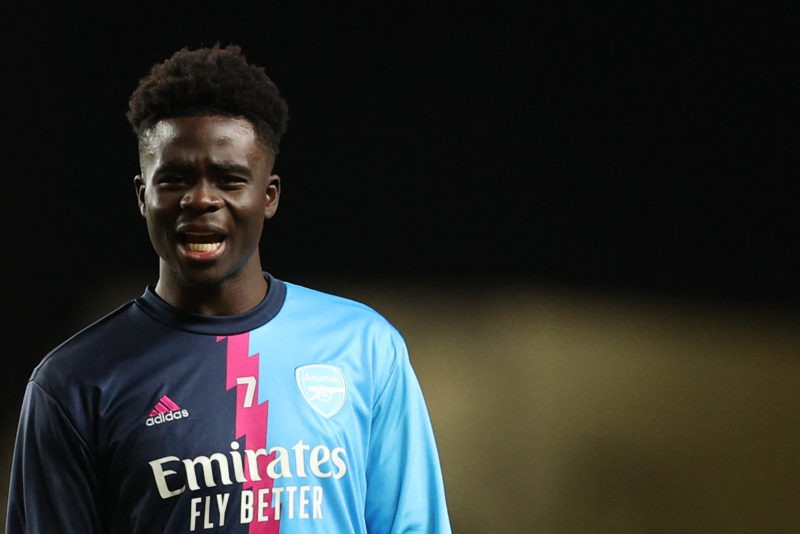 Arsenal's English midfielder Bukayo Saka reacts as he warms up prior to the FA Cup third round football match between Oxford United and Arsenal at the Kassam Stadium in Oxford, west of London, on January 9, 2023. (Photo by ADRIAN DENNIS/AFP via Getty Images)