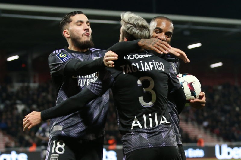 Lyon's French forward Alexandre Lacazette (R) is congratulated by teammates after scoring a goal during the L1 Football match Ajaccio vs Lyon at th...