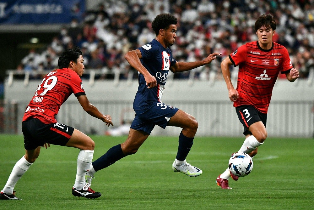 Paris Saint-Germain's French midfielder Warren Zaire-Emery (C) runs with the ball during PSG's Japan Tour football match against Urawa Reds at the ...