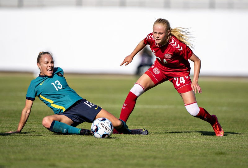 Denmark's Kathrine Kuhl and Australia's Tameka Yallop vie for the ball during the women's international friendly football match between Denmark and...
