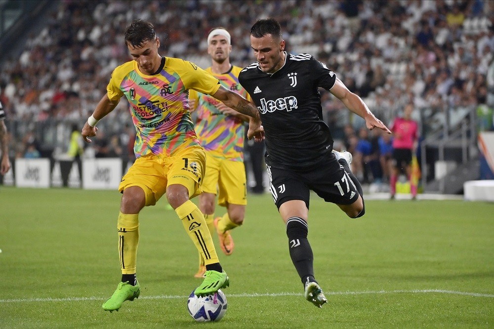 TURIN, ITALY: (L-R) Jakub Kiwior of Spezia Calcio against Filip Kostic of Juventus FC during the Serie A match between Juventus and Spezia Calcio a...