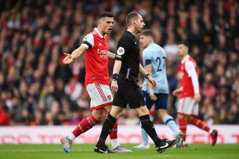 LONDON, ENGLAND - FEBRUARY 11: Granit Xhaka of Arsenal confronts match referee Peter Bankes during the Premier League match between Arsenal FC and ...