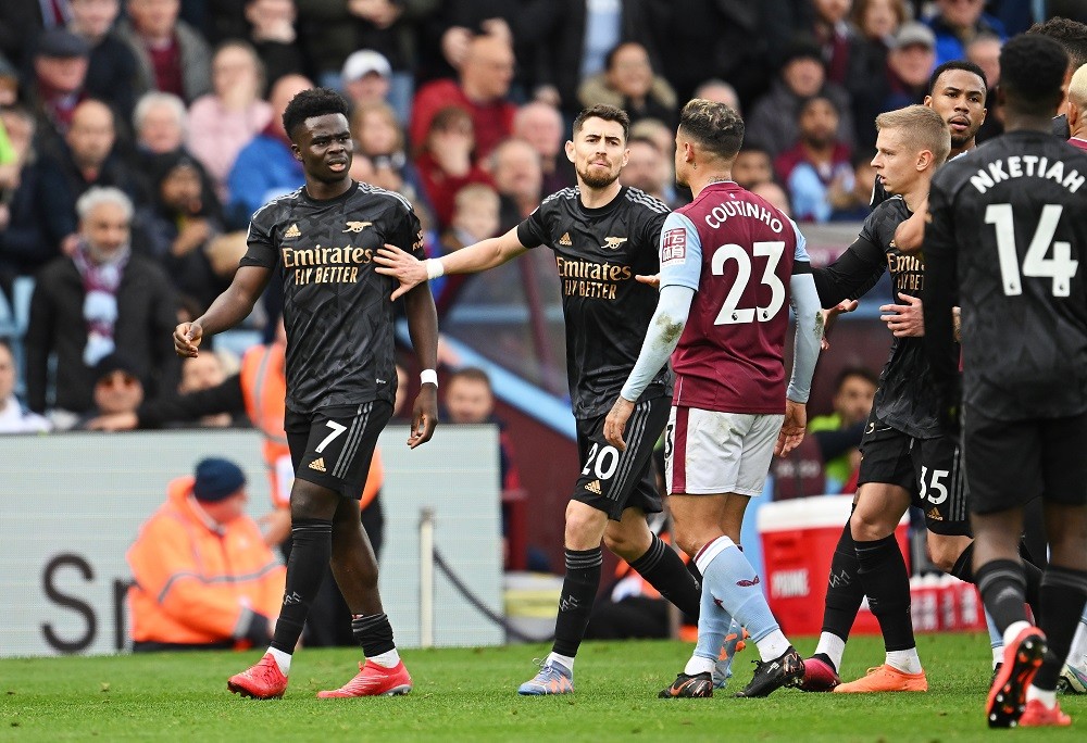 BIRMINGHAM, ENGLAND: Bukayo Saka and Jorginho of Arsenal clash with Philippe Coutinho of Aston Villa during the Premier League match between Aston ...