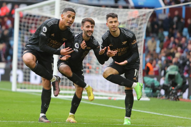 Arsenal's Brazilian midfielder Gabriel Martinelli (R) celebrates with Arsenal's Portuguese midfielder Fabio Vieira (C) and Arsenal's French defende...