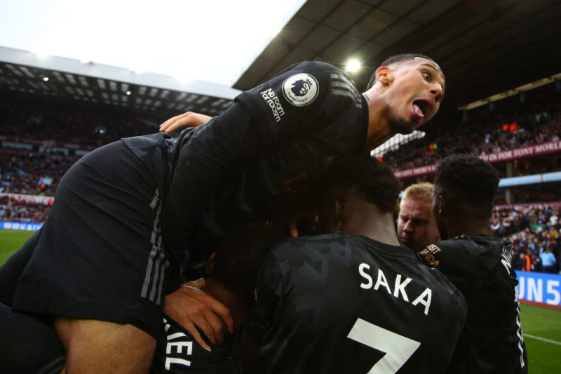 Arsenal's French defender William Saliba (C) celebrates after a shot from Arsenal's Italian midfielder Jorginho ends up in the net, rebounding off ...