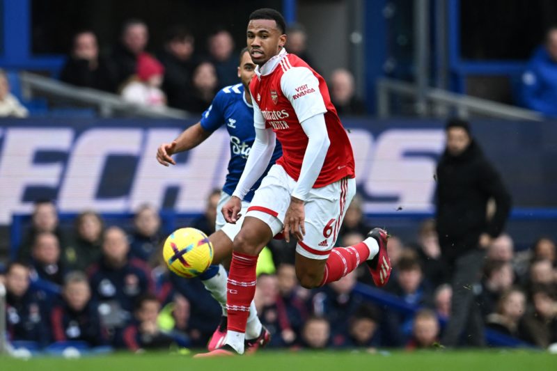 Arsenal's Brazilian defender Gabriel Magalhaes runs with the ball past Everton's English striker Dominic Calvert-Lewin (back) during the English Premier League football match between Everton and Arsenal at Goodison Park in Liverpool, north-west England, on February 4, 2023.(Photo by PAUL ELLIS/AFP via Getty Images)