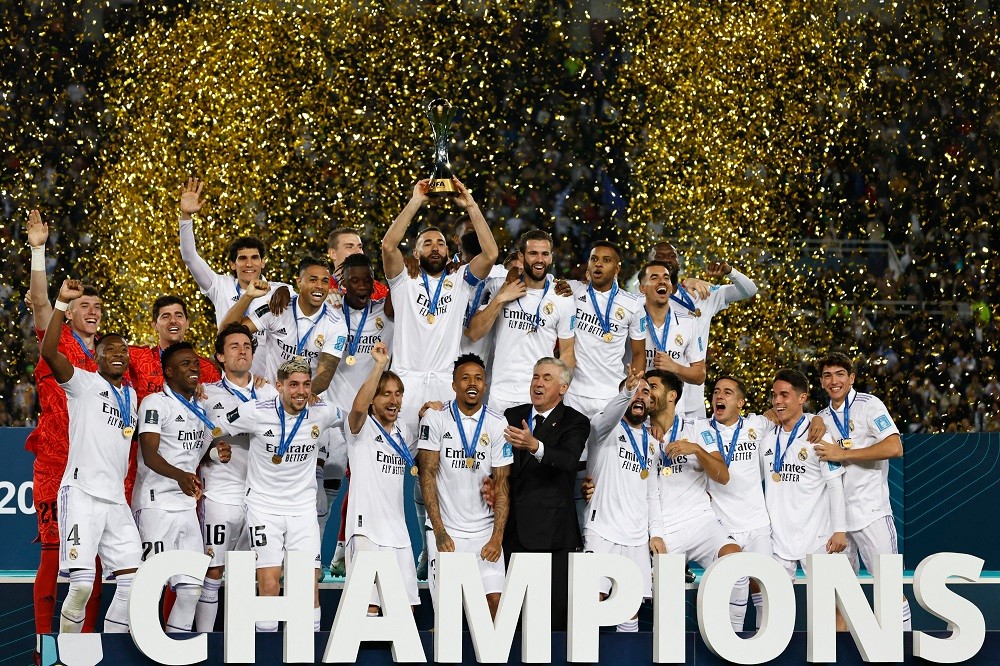 Real Madrid's players celebrate with the trophy at the end of the FIFA Club World Cup final football match between Spain's Real Madrid and Saudi Ar...