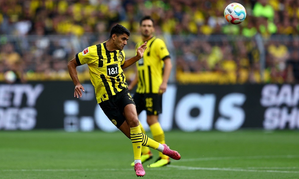 DORTMUND, GERMANY: Mahmoud Dahoud of Dortmund heads the ball during the Bundesliga match between Borussia Dortmund and Bayer 04 Leverkusen at Signal Iduna Park on August 06, 2022. (Photo by Lars Baron/Getty Images)