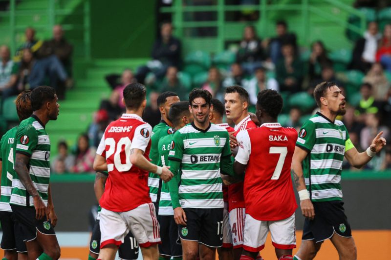 Players argue between themselves about a referee decision during the UEFA Europa League last 16 first leg football match between Sporting CP and Ar...