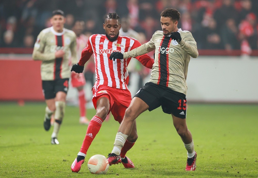 Arsenal target exciting Ajax star Devyne Rensch 2 BERLIN, GERMANY: Jordan Siebatcheu of 1.FC Union Berlin battles for possession with Devyne Rensch of AFC Ajax during the UEFA Europa League knockout round play-off second leg match between 1. FC Union Berlin and AFC Ajax at Stadion an der alten Försterei on February 23, 2023 in Berlin, Germany. (Photo by Martin Rose/Getty Images)