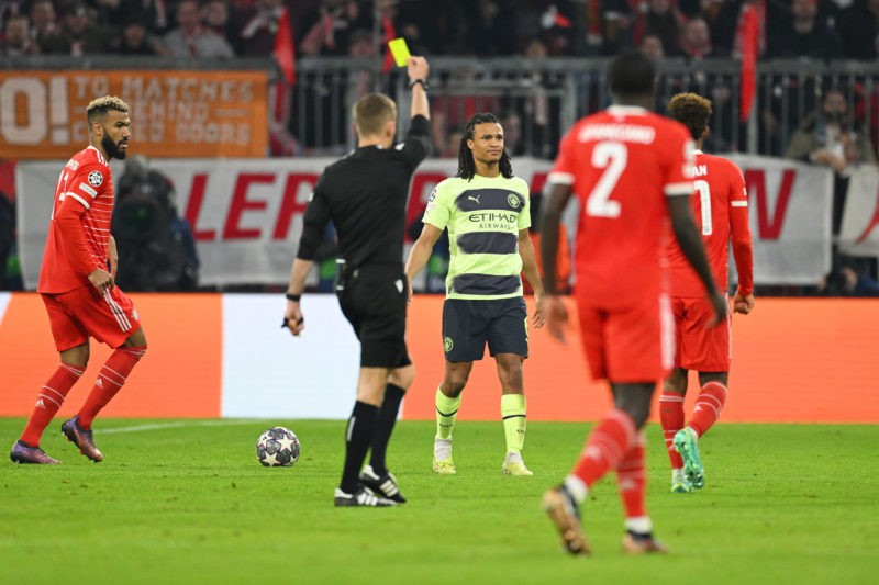 Nathan Ake ruled out of Manchester City v Arsenal 2 MUNICH, GERMANY - APRIL 19: Nathan Ake of Manchester City is shown a yellow card by Referee Clement Turpin during the UEFA Champions League quarterfinal second leg match between FC Bayern München and Manchester City at Allianz Arena on April 19, 2023 in Munich, Germany. (Photo by Matthias Hangst/Getty Images)