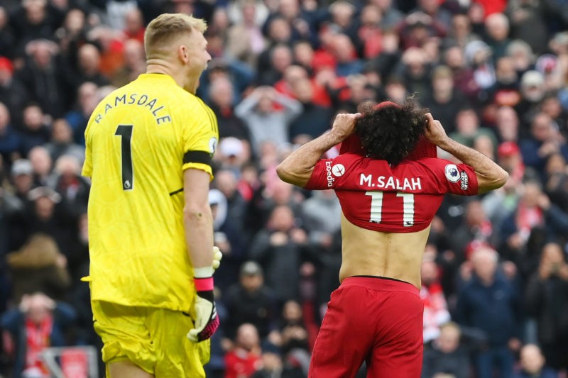 LIVERPOOL, ENGLAND - APRIL 09: Mohamed Salah of Liverpool reacts after missing a penalty kick as Aaron Ramsdale of Arsenal looks on during the Prem...